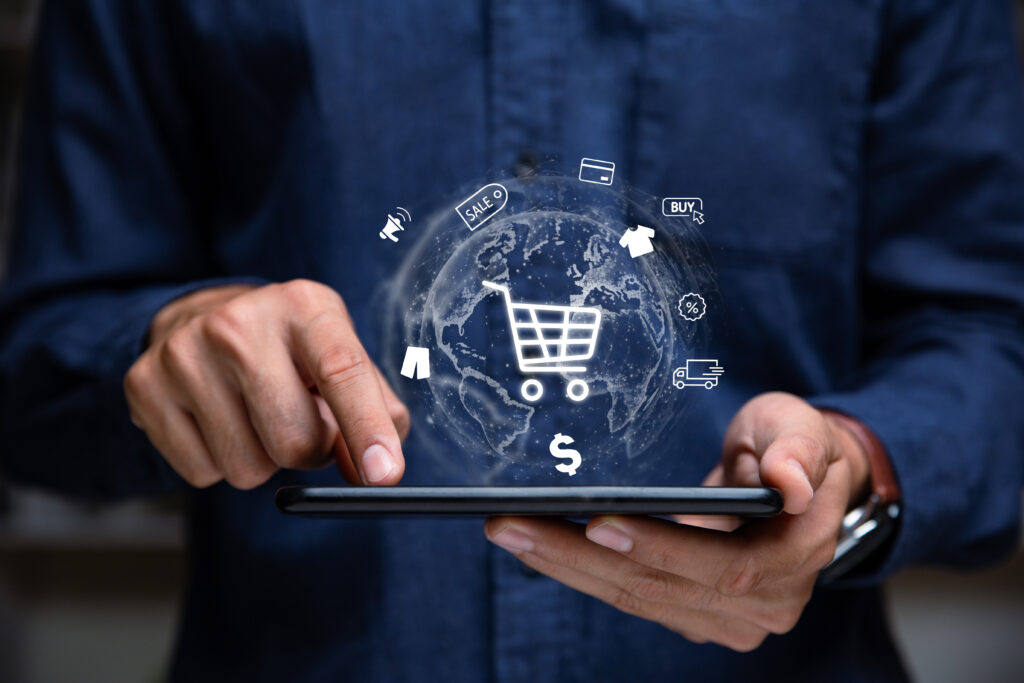 Hand Of Businessman Showing Shopping Cart Icon On Tablet. - fas group